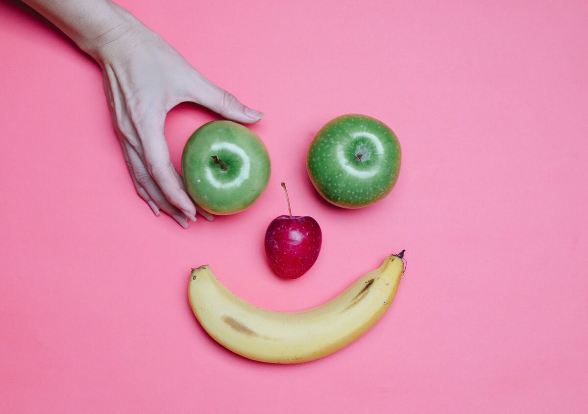 Different fruits placed to make a smiley face. Fruits represent antioxidants.