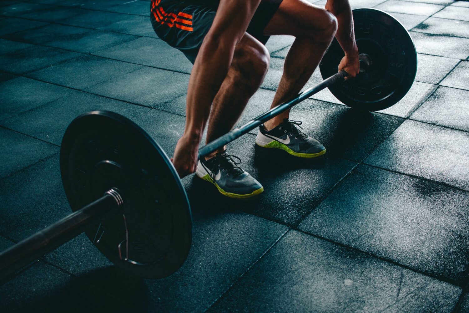 person holding barbell