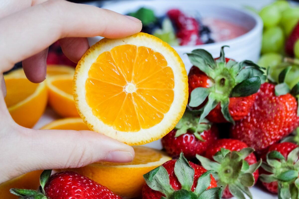 sliced orange fruit and strawberries