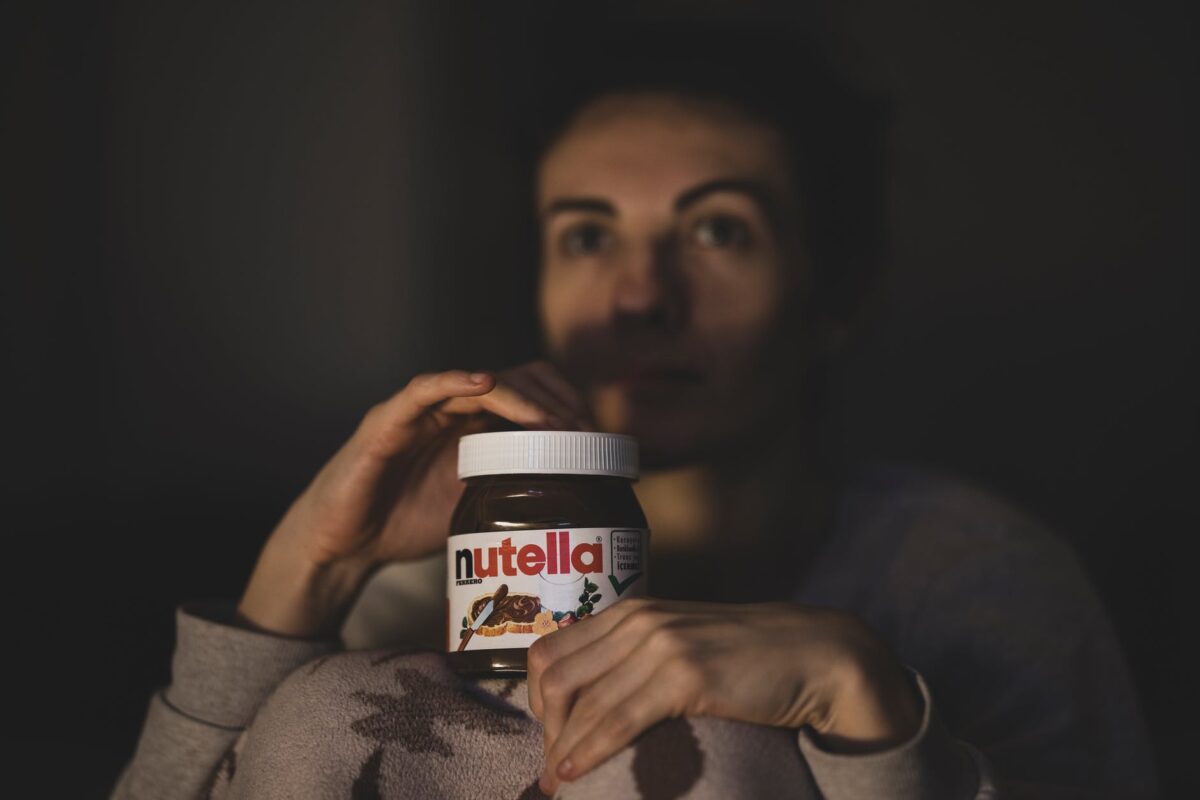 light fashion man person displaying nutella for calories reasons