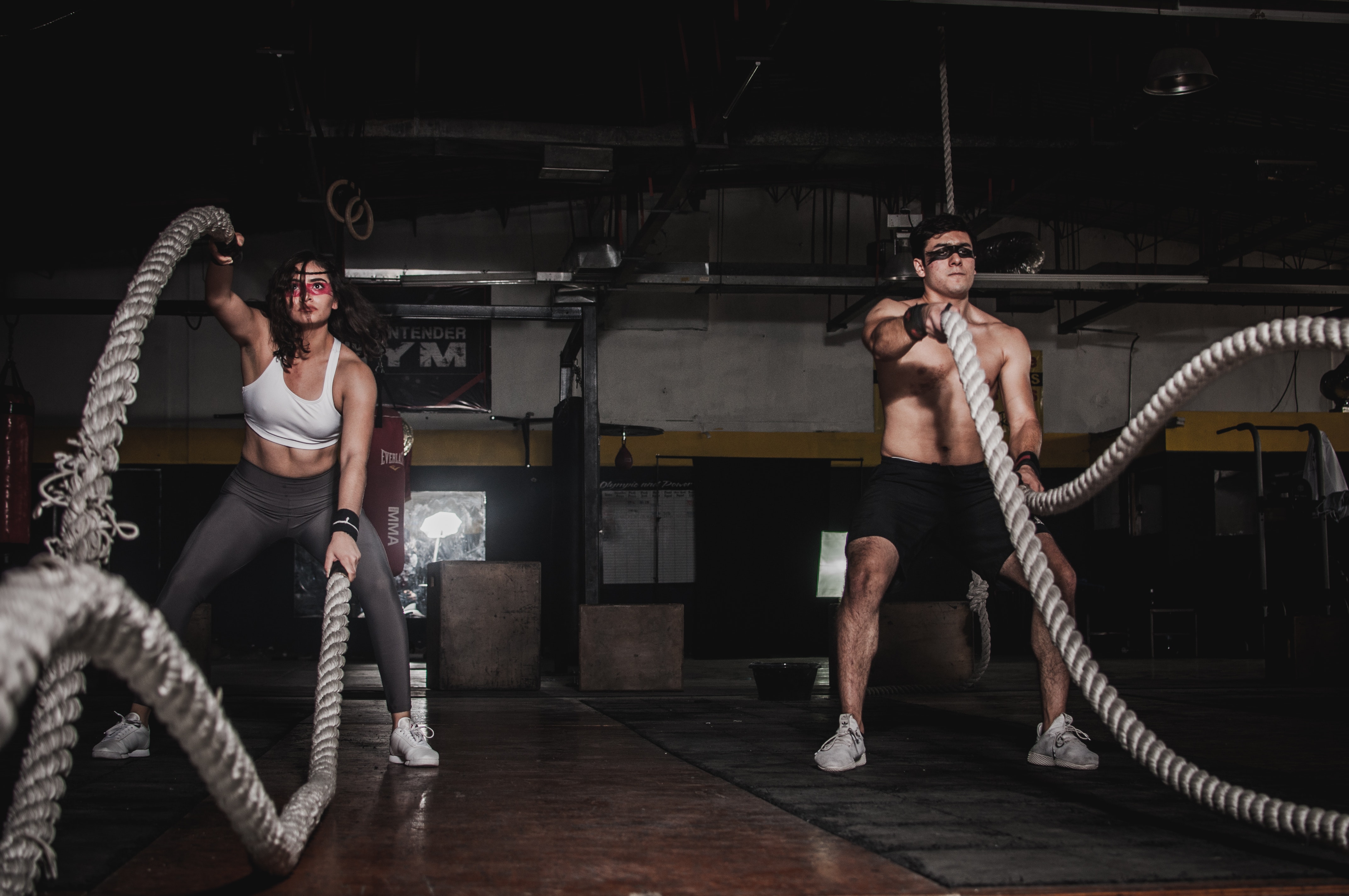 Man and woman get total body fitness and renewal with battle ropes